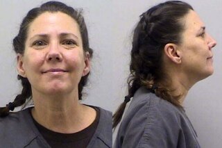 FILE - This undated booking photo provided by the Douglas County Sheriff's Office, in Colorado, shows Cynthia Abcug. Abcug, accused of plotting with supporters of QAnon to have her son kidnapped from foster care, pleaded not guilty to second-degree kidnapping on Friday, Sept. 25, 2020.  (Douglas County Sheriff's Office via AP, File)
