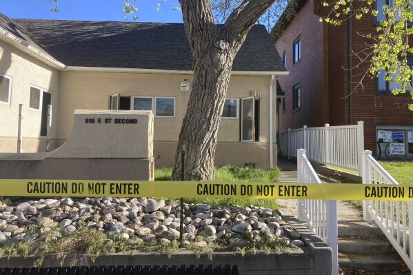 FILE - The fire-damaged Wellspring Health Access clinic is cordoned by tape, May 25, 2022, in Casper, Wyo. A judge is set to consider a plea deal Thursday, July 20, 2023, for an abortion opponent who investigators say burned Wyoming's first full-service abortion clinic in years. (AP Photo/Mead Gruver, File)