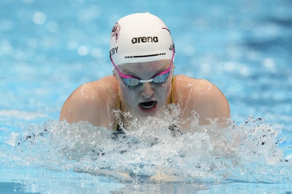 Lydia Jacoby swims during the Women's 100 breaststroke preliminary heat Sunday, June 16, 2024, at the US Swimming Olympic Trials in Indianapolis. (AP Photo/Michael Conroy)