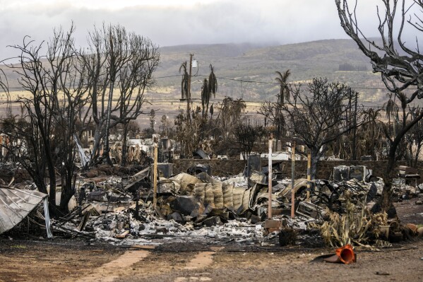 Properties destroyed by fire are seen in Lahaina, Hawaii Wednesday, Aug. 16, 2023. Hawaii's governor vowed to protect local landowners from being “victimized” by opportunistic buyers when Maui rebuilds from deadly wildfires that incinerated a historic island community and killed more than 100 people. (Stephen Lam/San Francisco Chronicle via AP)