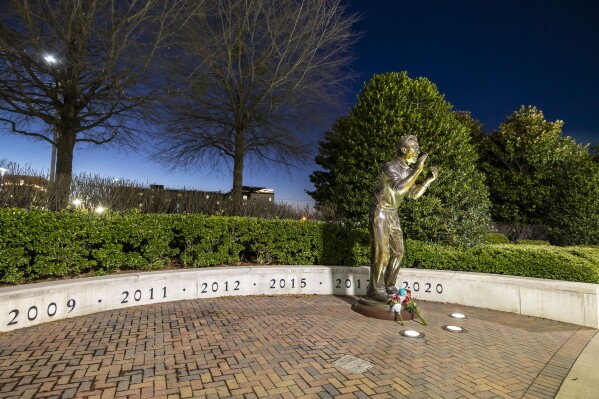 The statue of Alabama football coach Nick Saban stands on the Walk of Champions at Bryant-Denny Stadium on Wednesday, Jan. 10, 2024, in Tuscaloosa, Ala. Saban, who won seven national championships — more than any other major college football coach — and turned Alabama back into a national powerhouse with six of those titles in just 17 seasons, is retiring, according to multiple outlets. (AP Photo/Vasha Hunt)