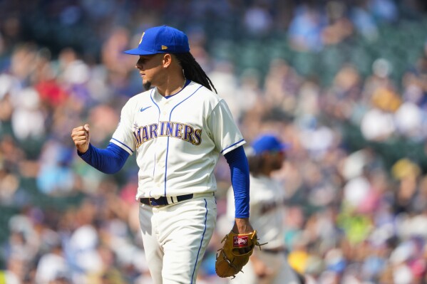 Seattle Mariners starting pitcher Luis Castillo walks off the field after pitching through the seventh inning of a baseball game against the Kansas City Royals, Sunday, Aug. 27, 2023, in Seattle. (AP Photo/Lindsey Wasson)