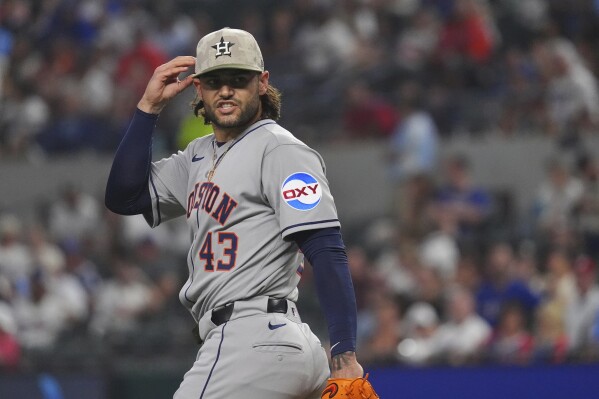 Houston Astros starting pitcher Lance McCullers Jr. reacts after a throw during the first inning of a baseball game against the Texas Rangers, Friday, May 16, 2025, in Arlington, Texas. (AP Photo/LM Otero)