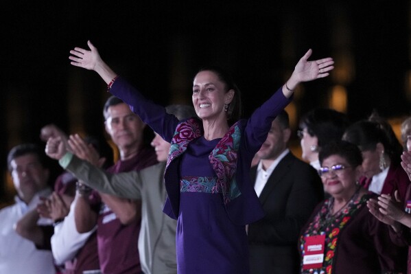 Future President Claudia Sheinbaum waves to supporters at the Zocalo, Mexico City's main square, after the National Electoral Institute announced she held an irreversible lead in the election, early Monday, June 3, 2024. (ĢӰԺ Photo/Marco Ugarte)