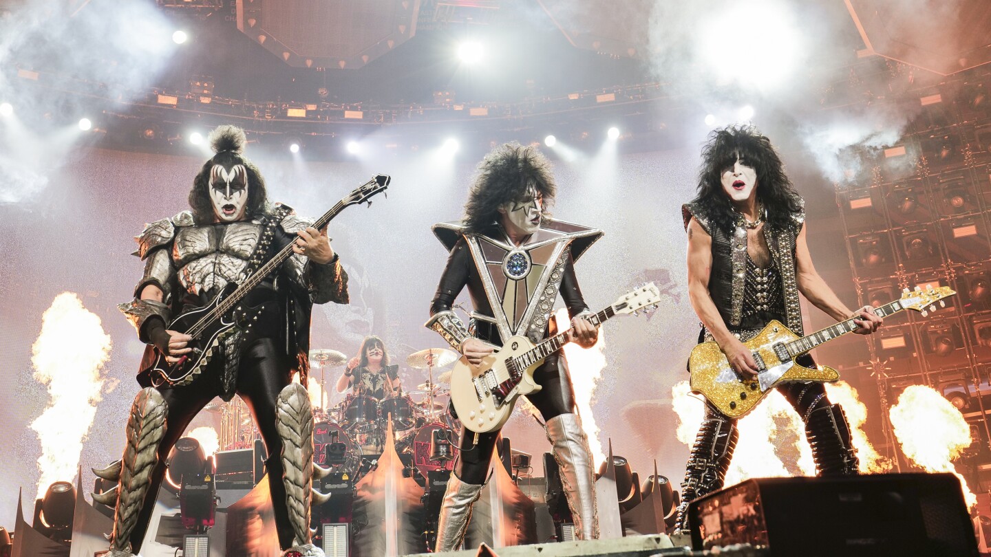 Gene Simmons, left, Tommy Thayer and Paul Stanley of KISS perform during the final night of the “Kiss Farewell Tour” on Saturday, Dec. 2, 2023, at