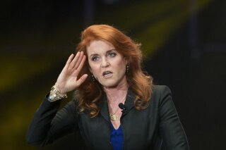 FILE - In this Monday, March 7, 2016 file photo, Sarah Ferguson, Duchess of York, salutes during a press event, in Mexico City. Ferguson has landed a book deal for her debut novel for adults, a historical romance fictionalizing the life and loves of her great-great-great aunt. In a promotional video posted on her Twitter account Wednesday, Jan. 13, 2021 the former Sarah Ferguson said the novel is set in the Victorian era and is “about daring to follow your heart against the odds.” (AP Photo/Rebecca Blackwell, file)
