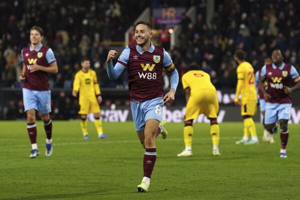 Burnley's Josh Brownhill celebrates scoring their side's fifth goal of the game during the English Premier League soccer match between Sheffield United and Burnley at Turf Moor, Burnley, England Saturday Dec. 2, 2023. (Martin Rickett/PA via AP)