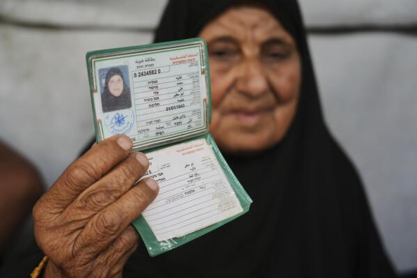 Ghalia Abu Moteir, whose family fled what is now Israel during the 1948 war that surrounded its creation, shelters from the current war in a tent in Khan Younis, Gaza Strip, after being displaced from her home in Rafah, Wednesday, May 14, 2025. (AP Photo/Abdel Kareem Hana)