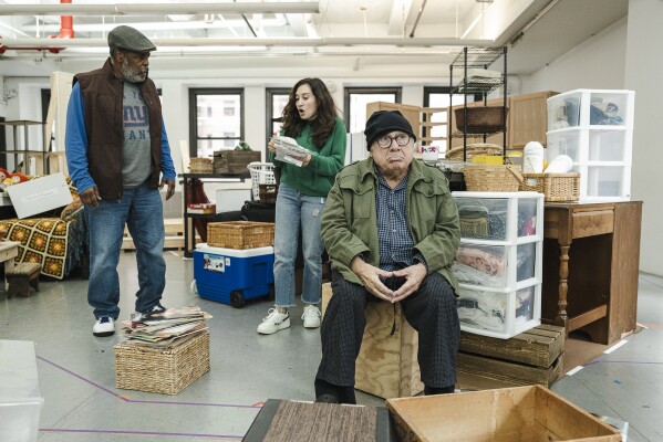 This image released by Polk PR shows, from left, Ray Anthony Thomas, Lucy DeVito, and Danny DeVito during a rehearsal for Theresa Rebeck's play "I Need That." (Marcus Middleton/Polk PR via AP)