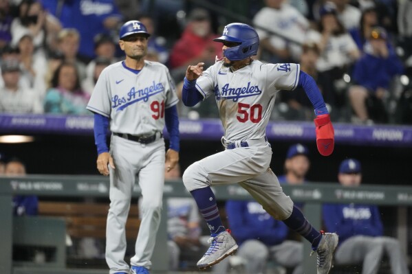 Martinez helps power Dodgers past Rockies 14-3 after a severe