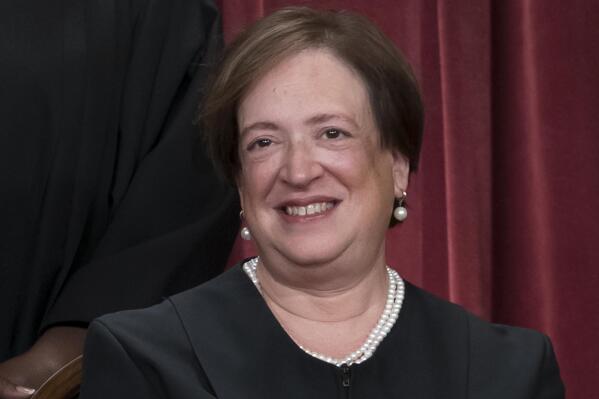 FILE - Associate Justice Elena Kagan joins other members of the Supreme Court as they pose for a new group portrait, at the Supreme Court building in Washington, Oct. 7, 2022. Kagan said Friday, Oct. 21, that “time will tell” whether the Supreme Court can get back to “finding common ground” after a term in which the court's six conservatives and three liberals split over major issues including abortion and gun rights. (AP Photo/J. Scott Applewhite, File)