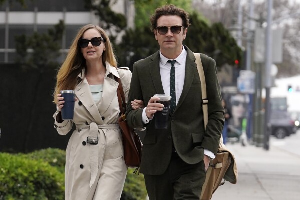 FILE - Danny Masterson, right, and his wife Bijou Phillips arrive for closing arguments in his second rape trial, May 16, 2023, in Los Angeles. On Monday, Sept. 18, Phillips filed for divorce from former “That '70s Show” star Masterson, days after he was sentenced to 30 years to life in prison for two rape convictions. (AP Photo/Chris Pizzello, File)