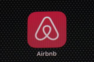 FILE - The Airbnb app icon is displayed on an iPad screen in Washington, D.C., on May 8, 2021. Airbnb Inc. reports quarterly financial results on Tuesday, Feb. 14, 2023. (AP Photo/Patrick Semansky, File)
