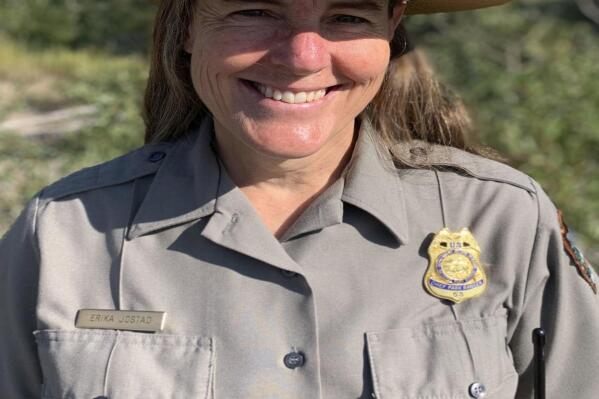 This Aug. 9, 2021 photo shows Chief Ranger Erika Jostad in Grand Teton National Park in Moose, Wyo. Erika Jostad’s baseline for what Grand Teton National Park is like in the summer, is skewed by 2021, easily the busiest year in the park’s 92-year-and-running history. Teton Park’s incoming permanent chief ranger has been in the job for months on an interim basis, during which time she’s overseen some 60 “incident responses” to fire — and that’s with a couple months of wildfire season remaining. The more general emergency call caseload has ballooned, too, outpacing gains in visitation and increasing nearly 70% over the average from the past five years.(Mike Koshmrl/Jackson Hole News & Guide via AP)