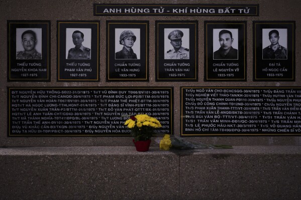 Fresh flowers are left at the Vietnam War Memorial honoring South Vietnamese military officers in the Little Saigon neighborhood of Westminster, Calif., Wednesday, April 23, 2025. (AP Photo/Jae C. Hong)
