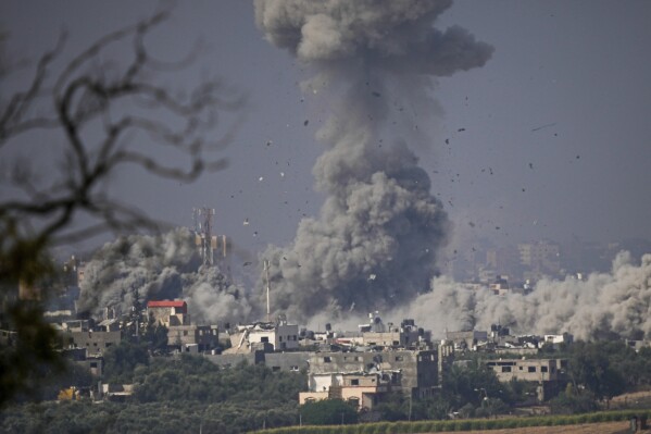 Smoke rises from an explosion following an Israeli airstrike in the Gaza Strip, as seen from southern Israel, Monday, Oct. 23, 2023. (AP Photo/Ariel Schalit)