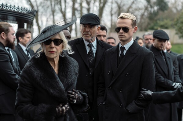 This image released by Paramount+ shows Helen Mirren, from left, Pierce Brosnan and Anson Boon in a scene from "Mobland." (Luke Varley/Paramount+ via AP)
