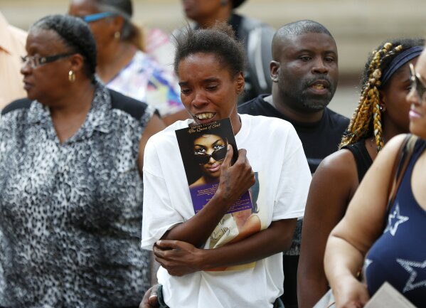 
              A member of the public becomes emotional viewing Aretha Franklin's coffin at Charles H. Wright Museum of African American History during a public visitation in Detroit, Tuesday, Aug. 28, 2018. Franklin died Aug. 16, of pancreatic cancer at the age of 76. (AP Photo/Paul Sancya, Pool)
            