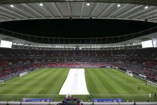 FILE - This Thursday, Dec. 18, 2020 file photo shows a general view of the Al Rayyan stadium during the opening ceremony in Al Rayyan, Qatar. A look at the state of play in Qatar's preparations for the 2022 World Cup amid ongoing criticism of the host nation as qualifying in Europe begins. (AP Photo/Hussein Sayed, file)
