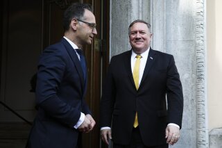 German Foreign Minister Heiko Maas, left, welcomes United States Secretary of State Mike Pompeo, right, at the foreign ministry's guest house Villa Borsig for talks in Berlin, Germany, Friday, May 31, 2019. Mike Pompeo is making his first visit to Germany as secretary of state at the start of a four-nation European trip as tensions rise between the U.S. and Iran. (AP Photo/Markus Schreiber, Pool)