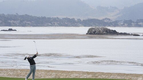 Ruoning Yin, of China, hits to the 18th green during a practice round for the U.S. Women's Open golf tournament at the Pebble Beach Golf Links, Tuesday, July 4, 2023, in Pebble Beach, Calif. (AP Photo/Darron Cummings)