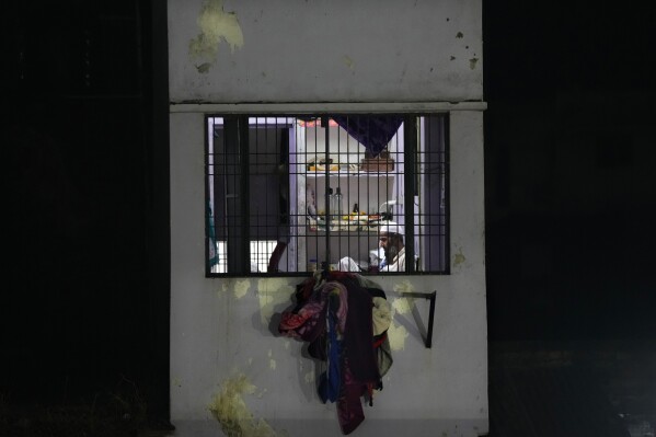 FILE- A Muslim rests in his house after breaking Ramadan fast in Ayodhya, India, on March 28, 2023. (AP Photo/Manish Swarup, File)