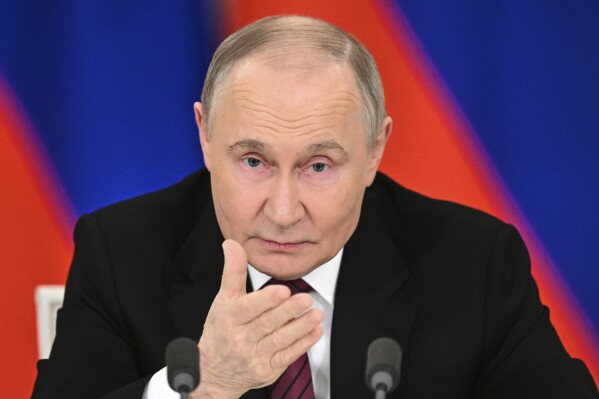 Russian President Vladimir Putin gestures as he speaks to journalists in the Grand Palace at the Kremlin in Moscow, Russia, Sunday, May 11, 2025, after celebrations of the 80th anniversary of the Soviet Union's victory over Nazi Germany during World War II. (Sergei Bobylev/Photo host agency RIA Novosti via AP)