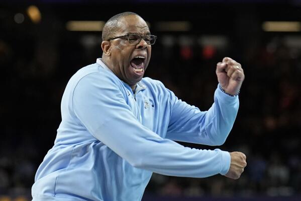 FILE - North Carolina head coach Hubert Davis reacts during the second half of a college basketball game against Kansas in the finals of the Men's Final Four NCAA tournament, Monday, April 4, 2022, in New Orleans. With four starters back from the team that blew a 15-point halftime lead to Kansas at the Superdome in New Orleans, the Tar Heels were the runaway pick as the preseason No. 1 in the AP Top 25 on Monday, Oct. 17, 2022. (AP Photo/Brynn Anderson, File)
