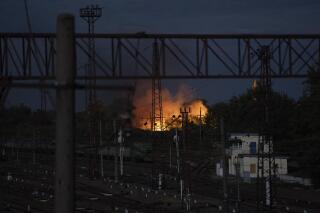 Flames rise from a f​ire following a Russian attack in Pokrovsk, Ukraine, Saturday, Sept. 10, 2022. (AP Photo/Leo Correa)