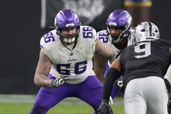 FILE - Minnesota Vikings guard Dalton Risner (66) lines up against the Las Vegas Raiders during the first half of an NFL football game Dec. 10, 2023, in Las Vegas. The Vikings are bringing back left guard Risner with the interior of their offensive line remaining an area in need of improvement. Risner agreed to a one-year contract to return to the Vikings after taking over the starting spot last season. (AP Photo/Rick Scuteri, File)