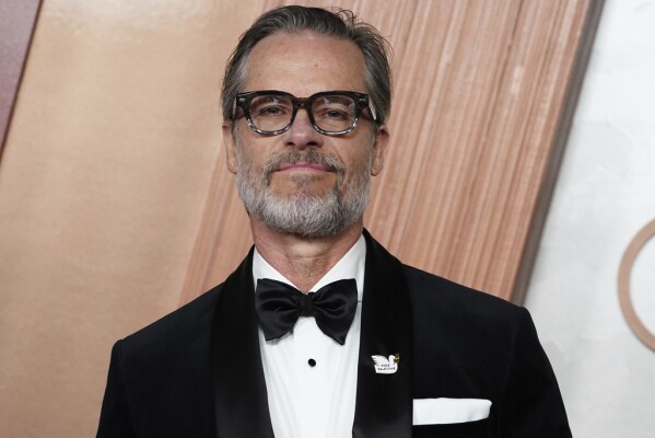 Guy Pearce arrives at the Oscars on Sunday, March 2, 2025, at the Dolby Theatre in Los Angeles. (Photo by Jordan Strauss/Invision/AP)