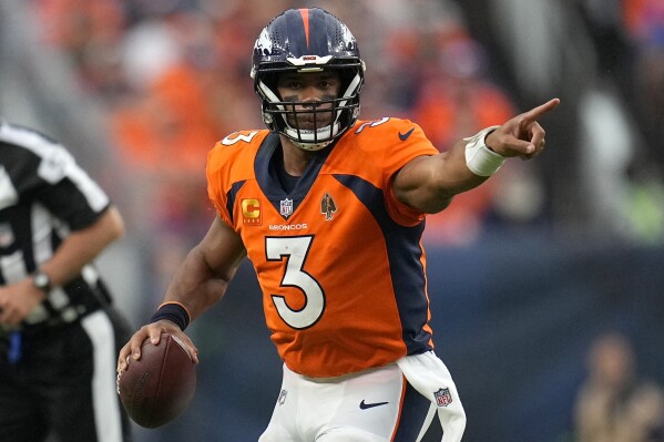 Denver Broncos quarterback Russell Wilson (3) looks for a receiver during the second half of an NFL football game against the Las Vegas Raiders, Sunday, Sept. 10, 2023, in Denver. (AP Photo/Jack Dempsey)