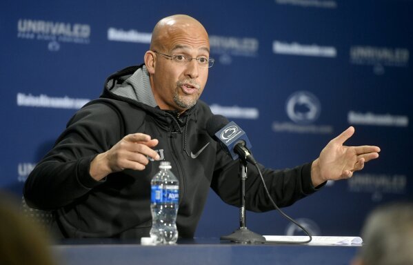 FILE - Penn State football coach James Franklin gestures during an NCAA college football press conference at Beaver Stadium in State College, Pa., in this Tuesday, Nov. 12, 2019, file photo. The NCAA made it official Thursday, April 15, 2021, announcing the Division I Council had voted to approve a proposal that would permit all college athletes to transfer one time as an undergraduate without having to sit out a season. “I don't think anything's changed,” Penn State football coach James Franklin said. “Let's be honest, over the last two years everybody knew all the transfer policies and the requirement to get immediate eligibility and everybody was saying whatever they had to say to become eligible.” (Abby Drey/Centre Daily Times via AP, File)