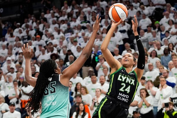 Minnesota Lynx forward Napheesa Collier (24) shoots over New York Liberty forward Jonquel Jones (35) during the second half in Game 3 of a WNBA basketball final playoff series, Wednesday, Oct. 16, 2024, in Minneapolis. (AP Photo/Abbie Parr, File)