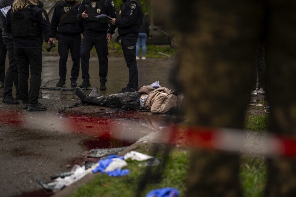 The body of a woman killed by Russian bombardment in Chernihiv, Ukraine, Wednesday, April 17, 2024. (AP Photo/Francisco Seco)
