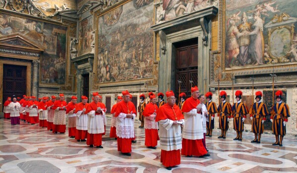 Cardinals walk in procession to the Sistine Chapel at the Vatican, at the beginning of the conclave, April 18, 2005. (Osservatore Romano via AP, File)