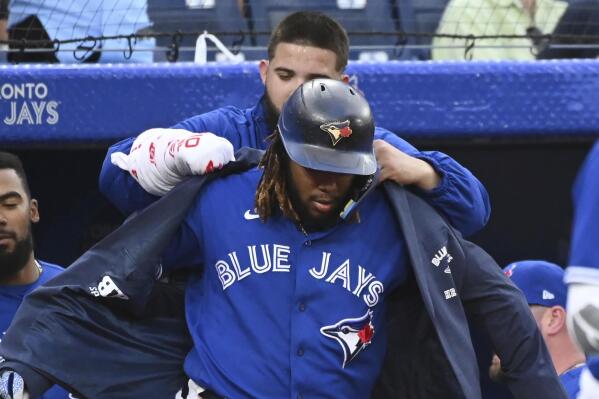 July 1, 2022, Toronto, ON, Canada: Toronto Blue Jays' Lourdes Gurriel Jr  has the home run jacket put on him by Vladimir Guerrero Jr after hitting a  solo home run in off