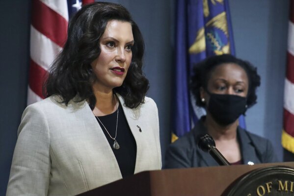 FILE - In this June 17, 2020, pool file photo provided by the Michigan Office of the Governor, Michigan Gov. Gretchen Whitmer speaks in Lansing, Mich. A federal appeals court late Wednesday, June 24, 2020, halted a lower judge's ruling and kept closed gyms and fitness centers that Whitmer ordered shut months ago to curb the coronavirus. (Michigan Office of the Governor via AP, Pool, File)