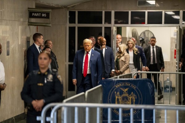 Former President Donald Trump walks in the hallway outside the court room at Manhattan Criminal Court in New York, Thursday, April 25 2024. (Mark Peterson/Pool Photo via AP)