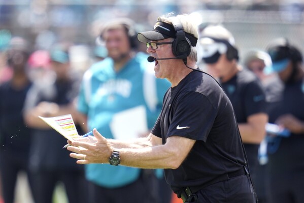 Jacksonville Jaguars head coach Doug Peterson signals to players during the first half of an NFL football game against the Kansas City Chiefs, Sunday, Sept. 17, 2023, in Jacksonville, Fla. (AP Photo/John Raoux)