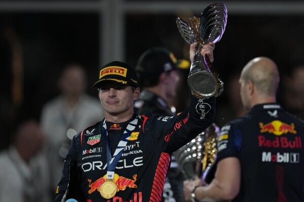Red Bull driver Max Verstappen of the Netherlands celebrates after winning the Abu Dhabi Formula One Grand Prix race at the Yas Marina Circuit, Abu Dhabi, UAE, Sunday, Nov. 26, 2023. (AP Photo/Kamran Jebreili)