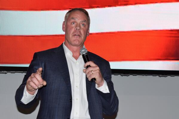 FILE - Montana House candidate and former Secretary of Interior Ryan Zinke speaks onstage at an event hosted by Butte-Silver Bow County Republicans at the Copper King Hotel and Convention Center, May 13, 2022, in Butte, Mont. An internal watchdog says Zinke lied to investigators about conversations he had with lobbyists, lawmakers and other officials regarding a bid by two Indian tribes to operate a casino in Connecticut. (AP Photo/Matthew Brown, File)