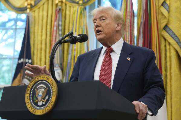 President Donald Trump speaks after David Perdue was sworn in as U.S. Ambassador to China during a ceremony in the Oval Office of the White House, Wednesday, May 7, 2025, in Washington. (AP Photo/Mark Schiefelbein)