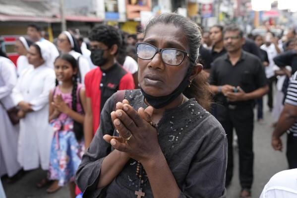 Sri Lankan Catholics with others take out a silent march to mark the fourth year commemoration of the 2019, Easter Sunday bomb attacks on Catholic Churches, in Colombo, Sri Lanka, Friday, April 21, 2023. Thousands of Sri Lankans held a protest in the capital on Friday, demanding justice for the victims of the 2019 Easter Sunday bomb attacks that killed nearly 270 people. (AP Photo/Eranga Jayawardena)