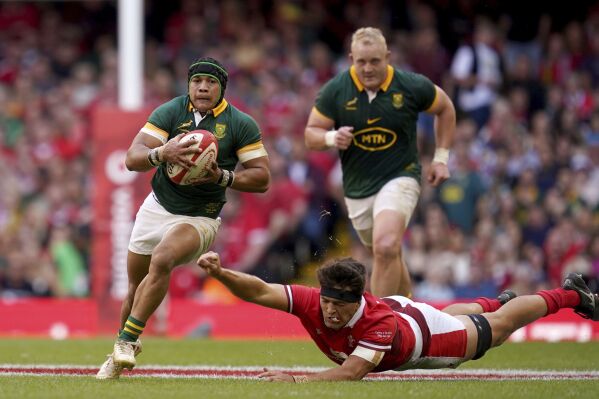 South Africa's Cheslin Kolbe breaks clear, during the Summer Nations Series match between Wales and South Africa at the Principality Stadium, in Cardiff, Saturday, Aug. 19, 2023. (David Davies/PA via AP)
