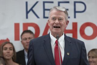FILE - Idaho Gov. Brad Little declares victory in the gubernatorial primary during the Republican Party's primary election celebration, May 17, 2022, in Boise, Idaho. Idaho’s individual income taxes, sales taxes and corporate income taxes all fell slightly below monthly projections for August 2022, the state budget office reported on Tuesday, Sept. 13, 2022. (AP Photo/Kyle Green, File)