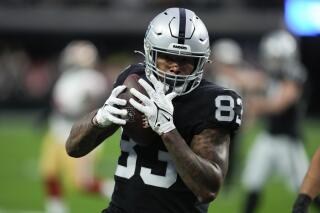 FILE - Las Vegas Raiders tight end Darren Waller runs into the end zone to score on a 24-yard touchdown pass during the first half of an NFL football game between the San Francisco 49ers and Las Vegas Raiders, Sunday, Jan. 1, 2023, in Las Vegas. Tight end Darren Waller is being traded to the New York Giants, who will send the Las Vegas Raiders a third-round draft pick, two people familiar with the deal said Tuesday, March 14, 2023. (AP Photo/John Locher, File)