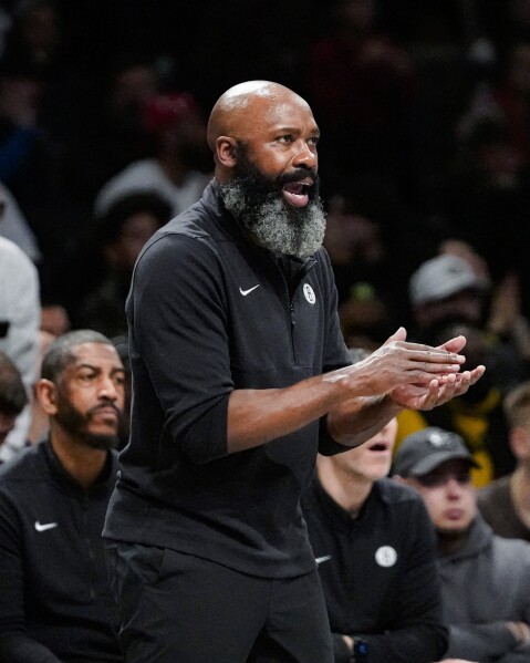 Brooklyn Nets coach Jacque Vaughn applauds the team during the second half of an NBA basketball game against the Milwaukee Bucks in New York, Wednesday, Dec. 27, 2023. (AP Photo/Peter K. Afriyie)