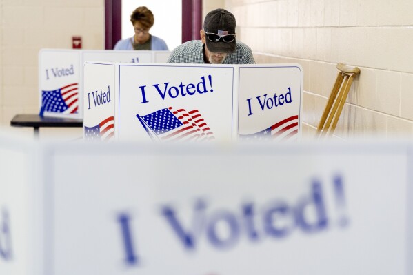 Residents vote at their voting precinct on the morning of the South Carolina Republican primary at New Bridge Academy in Cayce, S.C., Saturday, Feb. 24, 2024. (AP Photo/Andrew Harnik)