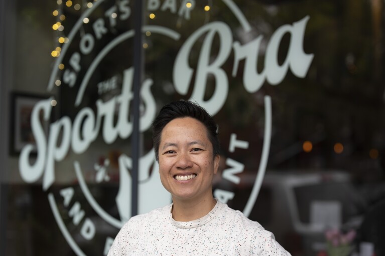 The Sports Bra founder and CEO Jenny Nguyen poses for a photo at the sports bar on Thursday, April 25, 2024, in Portland, Ore. (AP Photo/Jenny Kane)